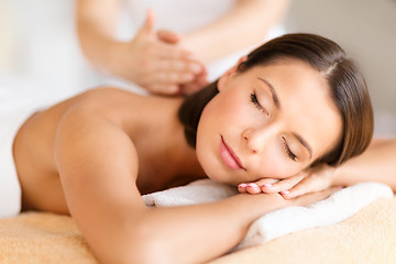 Image showing beautiful woman in spa salon getting massage