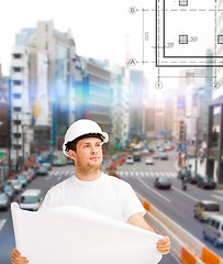 Image showing male architect looking at blueprint