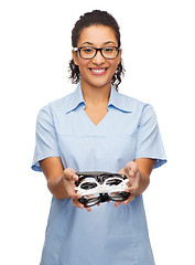 Image showing smiling female african-american doctor or nurse