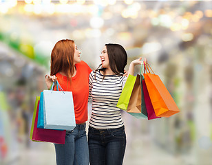 Image showing two smiling teenage girls with shopping bags