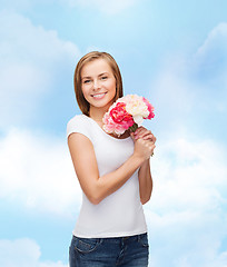 Image showing smiling woman with bouquet of flowers