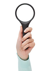 Image showing woman hand holding magnifying glass