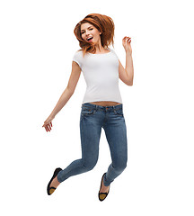 Image showing teenage girl in white blank t-shirt jumping