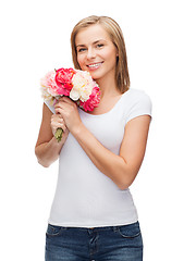 Image showing smiling woman with bouquet of flowers