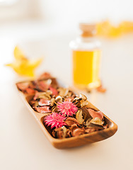 Image showing closeup of essential oil, flowers and pot-pourri