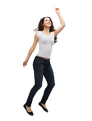 Image showing teenage girl in white blank t-shirt jumping