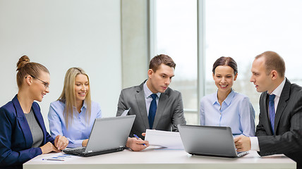 Image showing business team with laptop having discussion