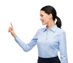 Image showing woman working with imaginary virtual screen