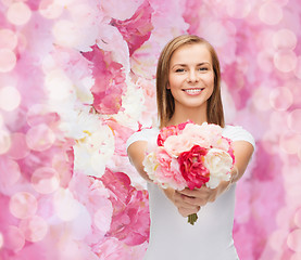 Image showing smiling woman with bouquet of flowers