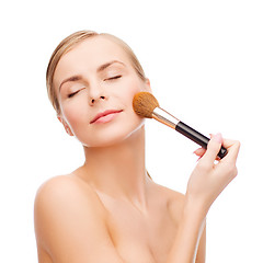 Image showing beautiful woman with makeup brush