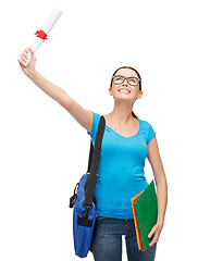 Image showing smiling student with bag and folders