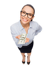 Image showing smiling businesswoman with dollar cash money