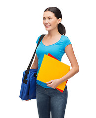 Image showing smiling student with bag and folders
