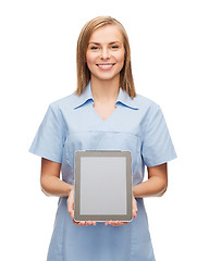 Image showing smiling female doctor or nurse with tablet pc