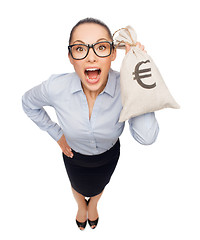 Image showing amazed businesswoman holding money bag with euro