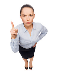 Image showing angry businesswoman with finger up
