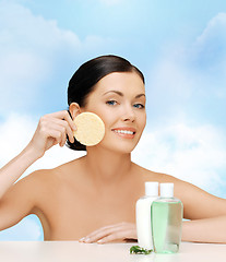 Image showing smiling woman with sponge