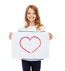 Image showing smiling little child holding picture of heart