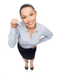 Image showing smiling businesswoman with house keys