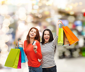 Image showing teenage girls with shopping bags and credit card