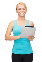 Image showing sporty woman with tablet pc