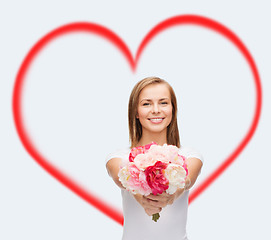 Image showing smiling woman with bouquet of flowers