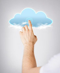 Image showing man hand pointing at cloud