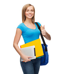 Image showing female student with bag, tablet pc and folders