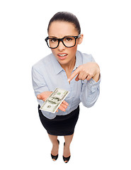 Image showing smiling businesswoman with dollar cash money