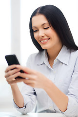 Image showing businesswoman or student with smartphone