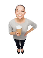 Image showing smiling asian woman with take away coffee cup