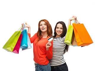 Image showing teenage girls with shopping bags and credit card