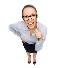 Image showing smiling businesswoman with finger up