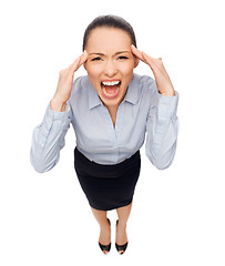 Image showing frightened businesswoman screaming