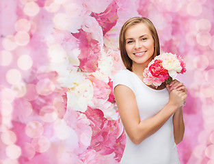 Image showing smiling woman with bouquet of flowers