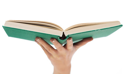 Image showing close up of woman hand holding open book