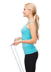Image showing sporty woman with with skipping rope