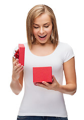 Image showing smiling girl with gift box