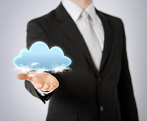 Image showing mans hand showing cloud