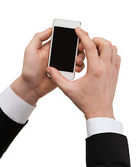 Image showing businessman touching screen of smartphone