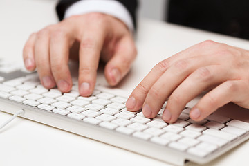 Image showing businessman working with keyboard