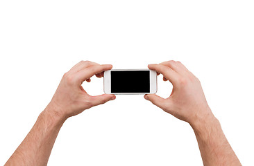 Image showing close up of man hands holding smartphone