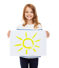 Image showing smiling little child holding picture of sun