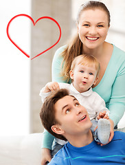 Image showing happy parents playing with adorable baby