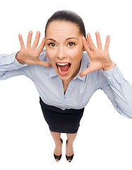 Image showing frightened businesswoman screaming