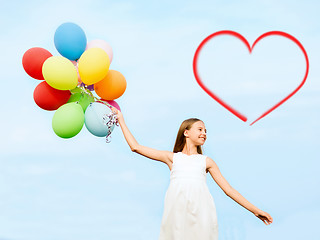 Image showing happy girl with colorful balloons