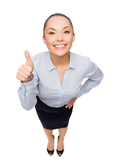 Image showing smiling asian businesswoman showing thumbs up