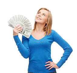 Image showing smiling girl with dollar cash money