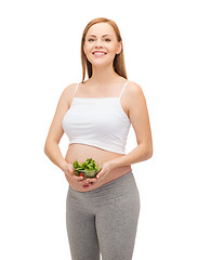 Image showing happy future mother with bowl of salad