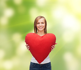 Image showing smiling woman in white t-shirt with heart